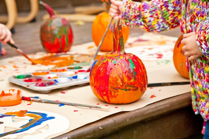 Pumpkins colorfully painted by children.