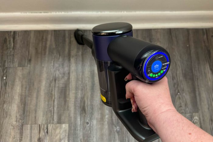 Cleaning wooden floor with vacuum cleaner