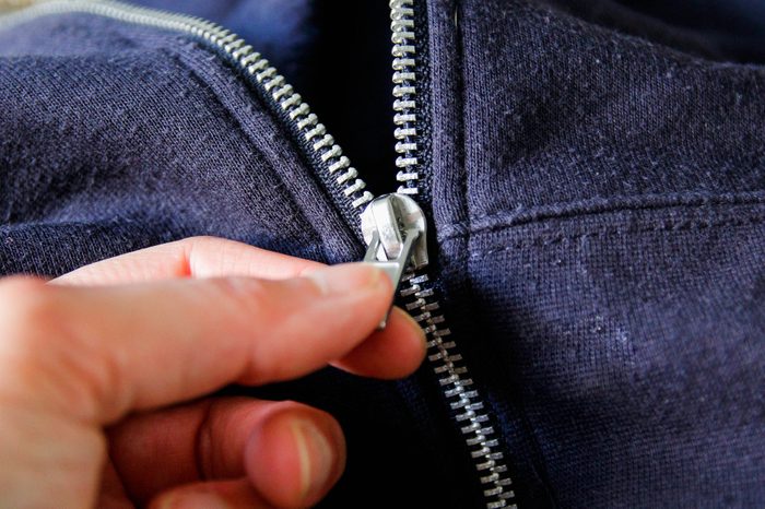 Zipper on blue sweatshirt