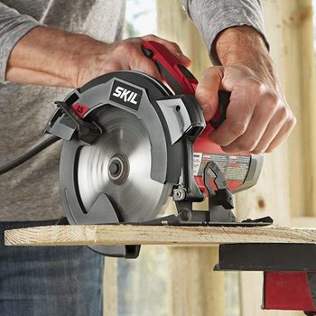 power tool sawing through wood