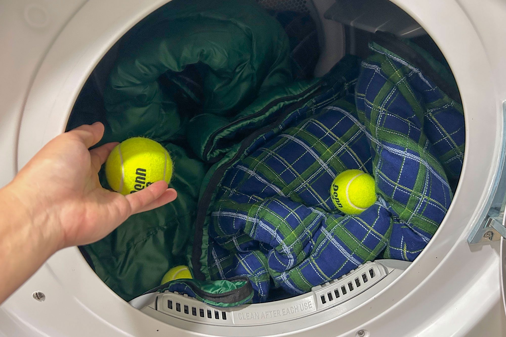 Toss in Tennis Balls to fluff and separate sleeping bag