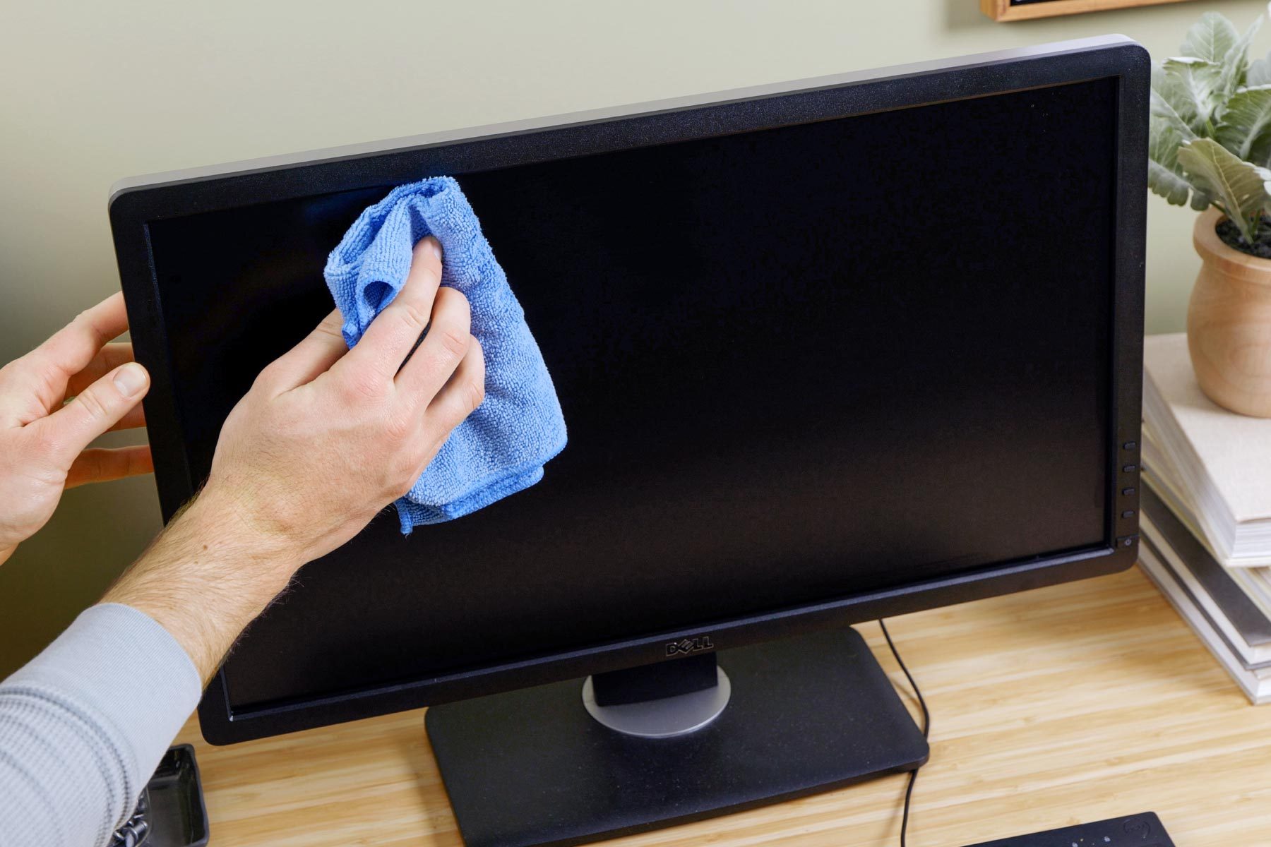 How To Clean A Computer Screen And Keyboard Wipe screen with damp microfiber cloth
