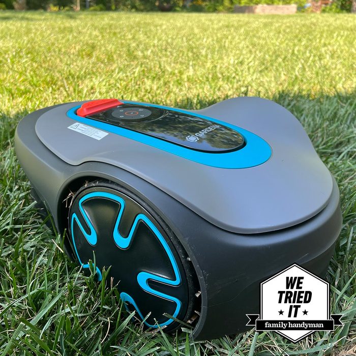 Blue modern lawn mowers on grass