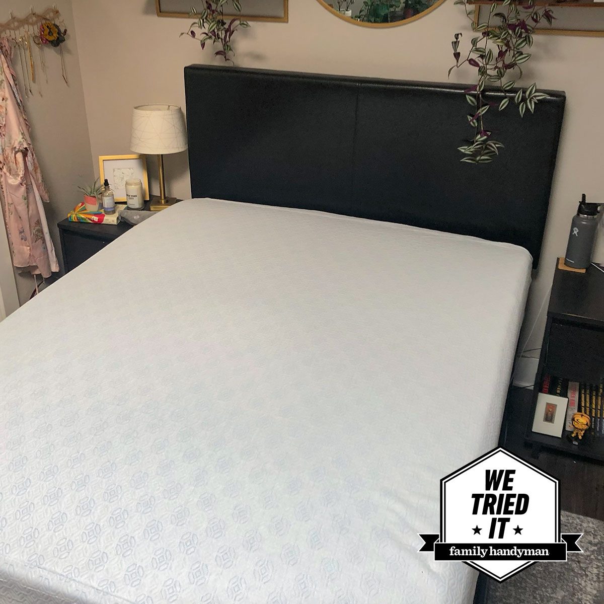 A bed with a mattress protector on it (Zinus green tea mattress)