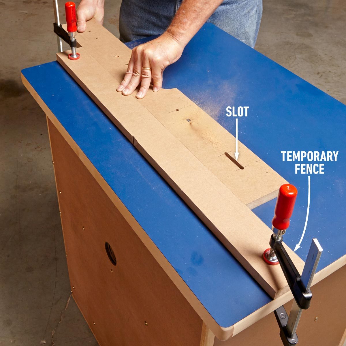 A man is using a table saw to cut a piece of wood into two fences.