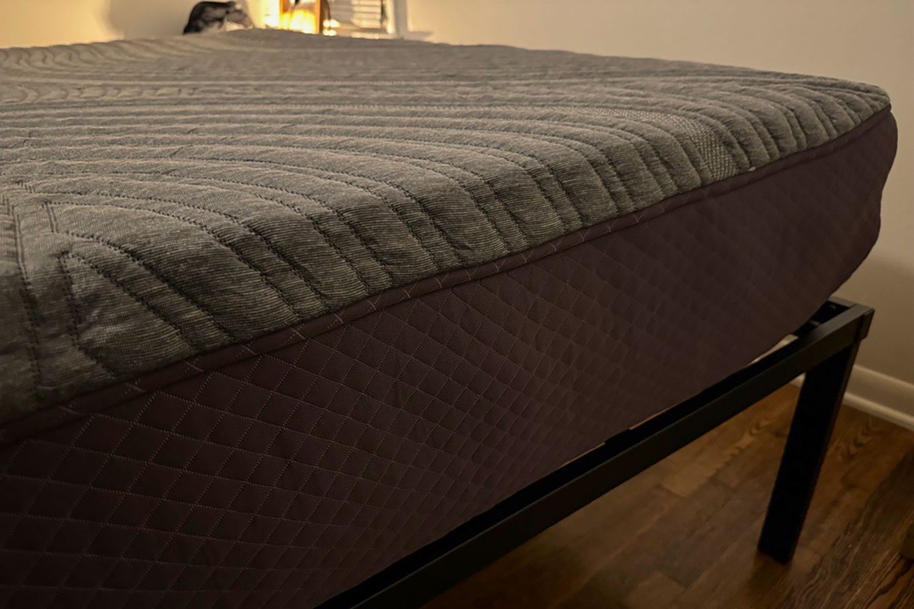 A bed with a mattress on top of it.