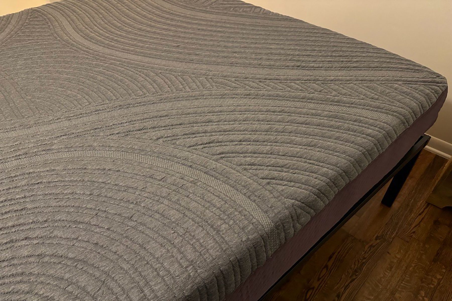 A bed with a mattress on top of it.