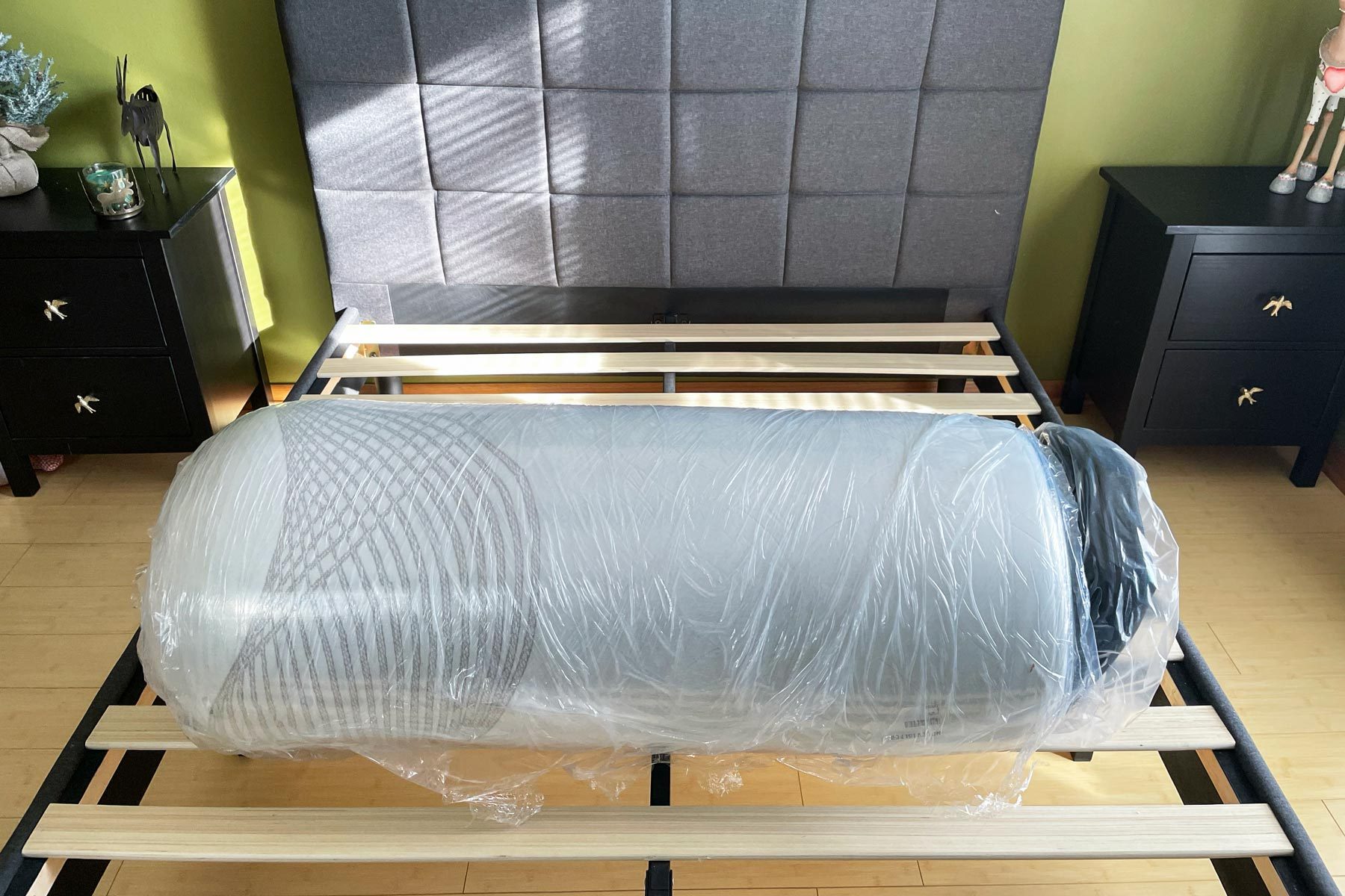 Nolah Mattress wrapped in plastic on a bed frame