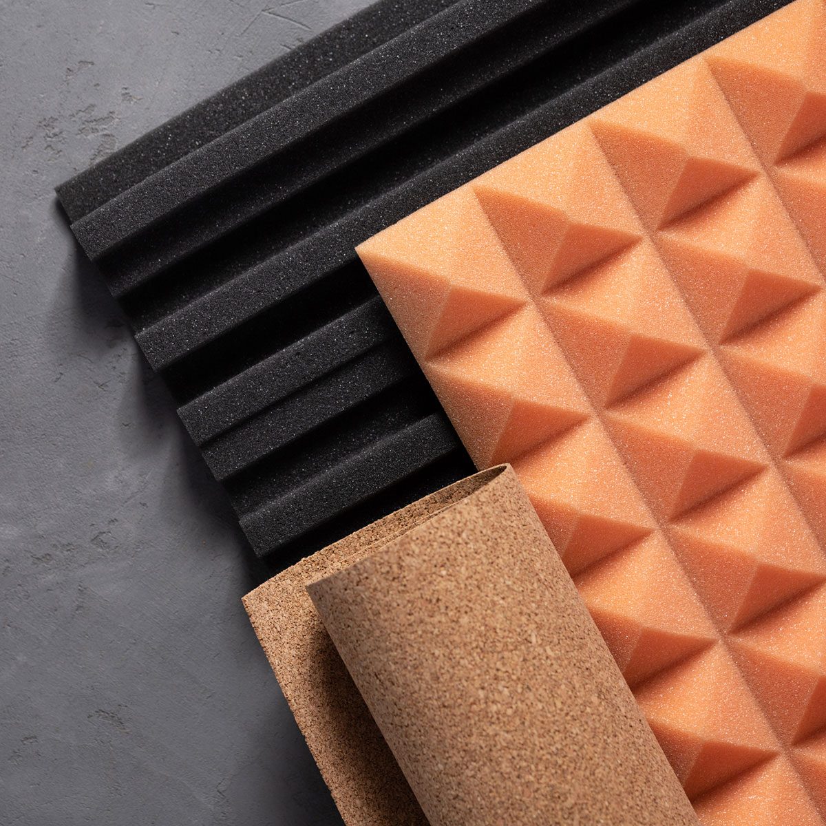 Acoustic foam and cork on concrete wall background. Sound isolation material for record studio