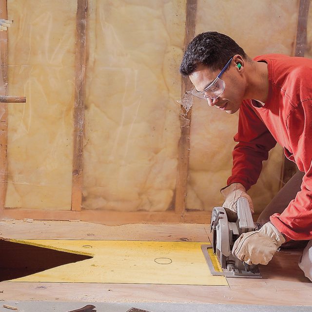 Cut an access slot for the new drain