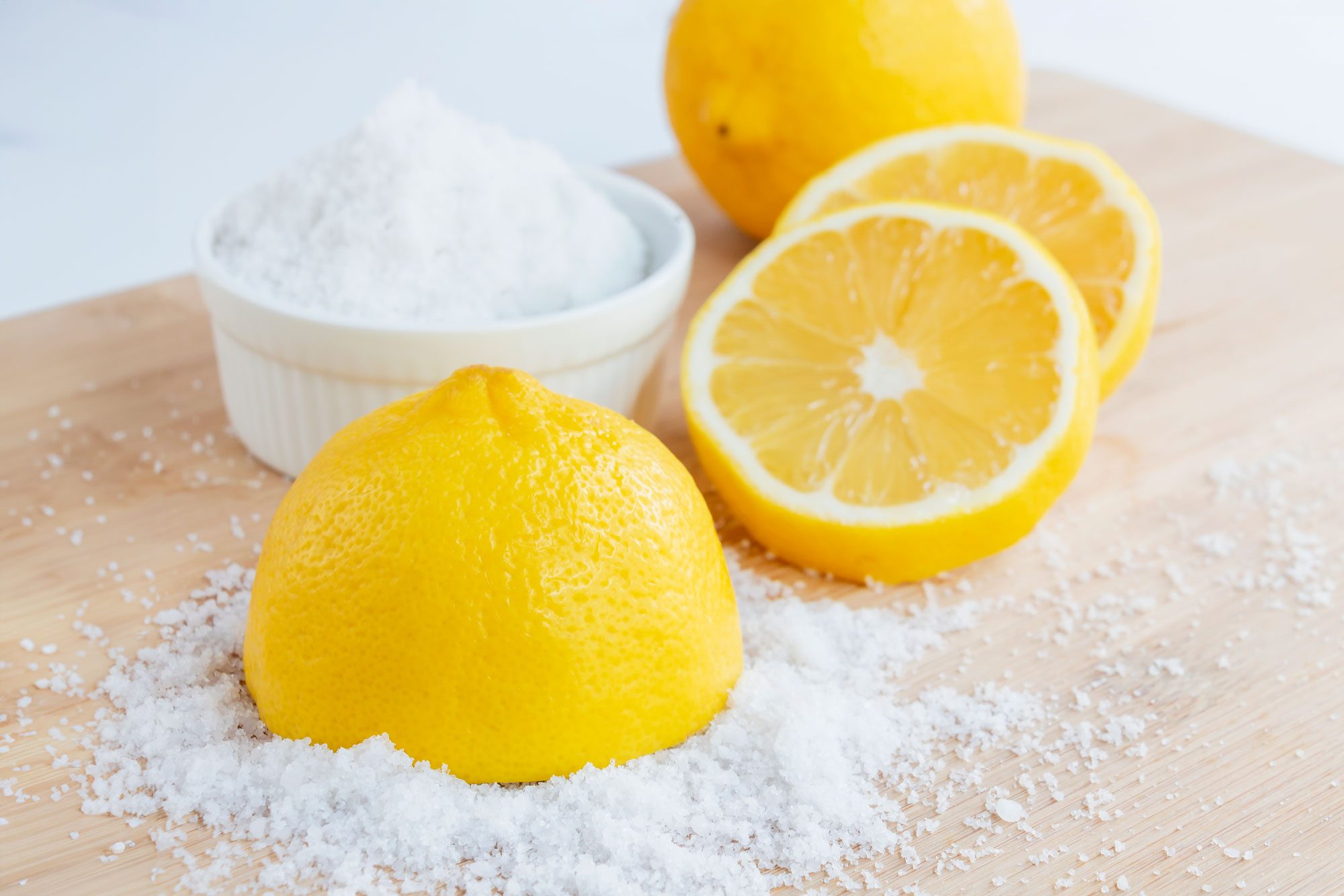 Lemon And Sea Salt On A Wooden Surface
