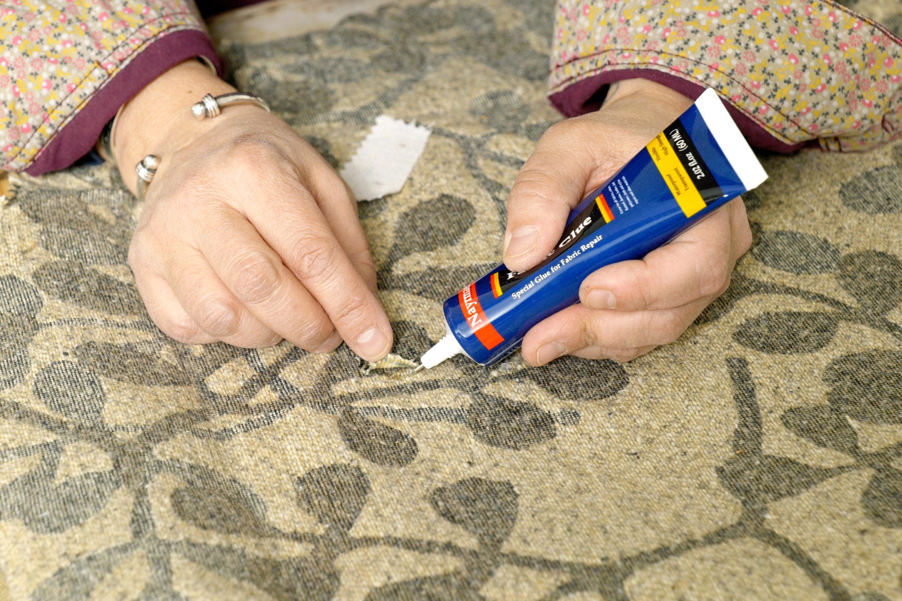 Upholstery Repair How To Fix A Hole Glue patch into place