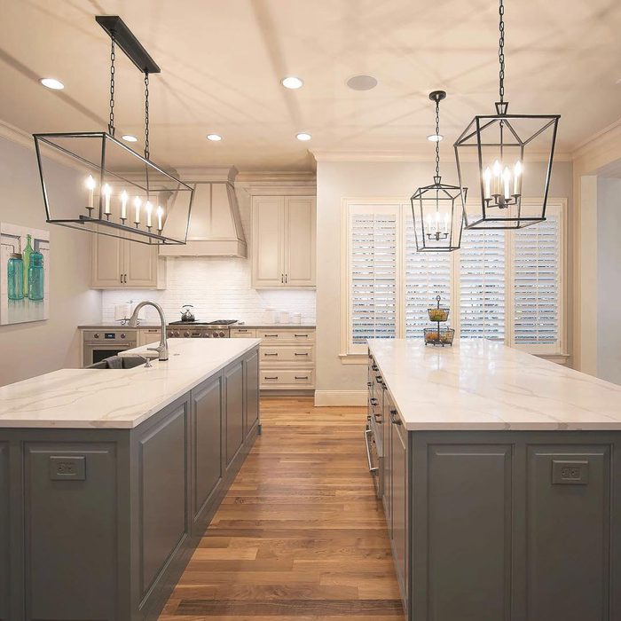 Kitchen space with two grey counters and warm lights