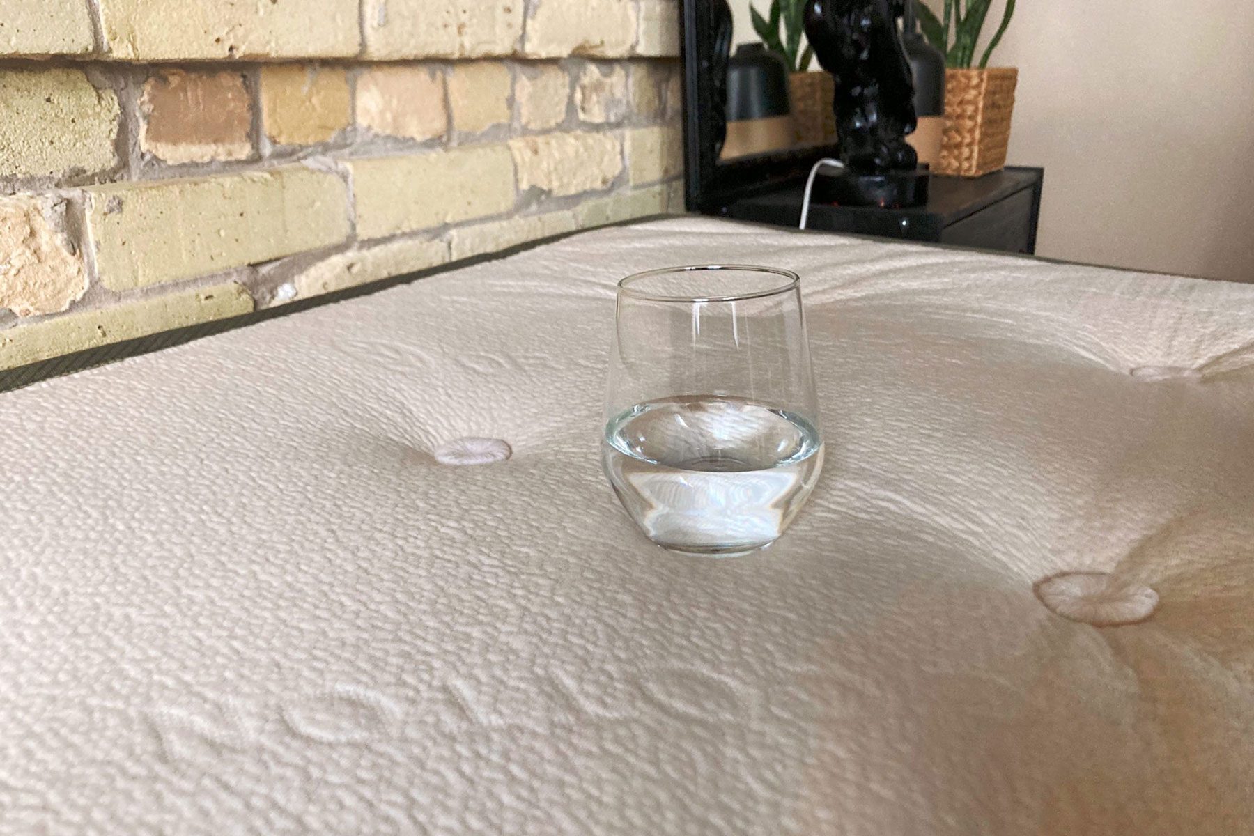 Glass Of Water On Avocado Green Mattress
