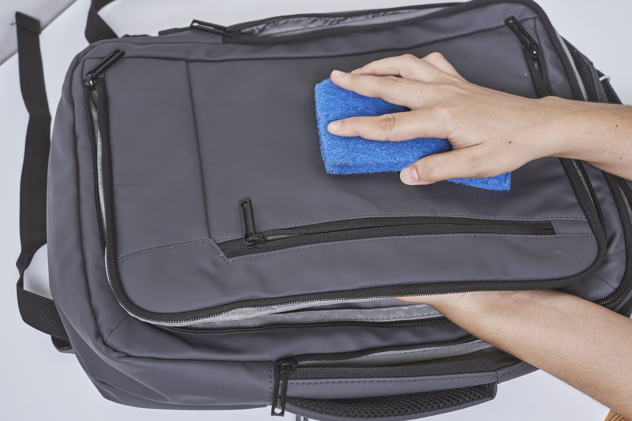 Cleaning backpack with washcloth
