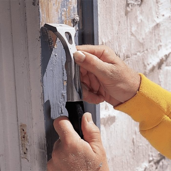 Using paint scraper to scrape paint