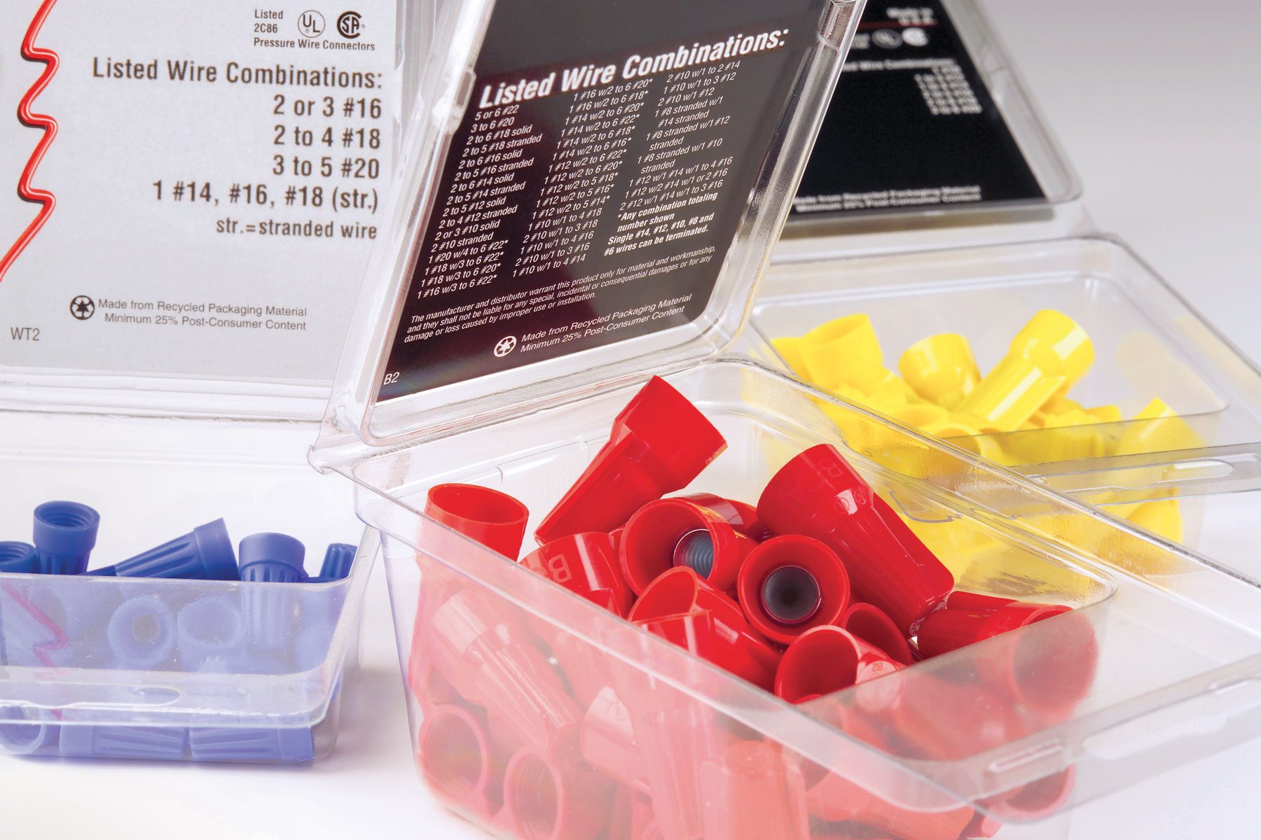 Three different kinds of wire nuts in transparent boxes.