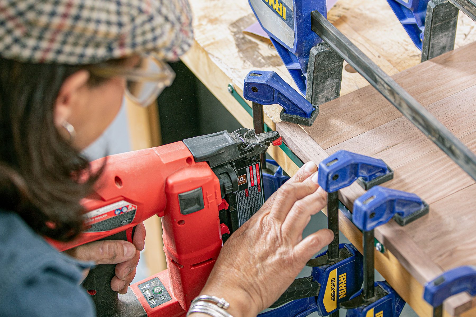 wooden trim pieces for panels being nailed