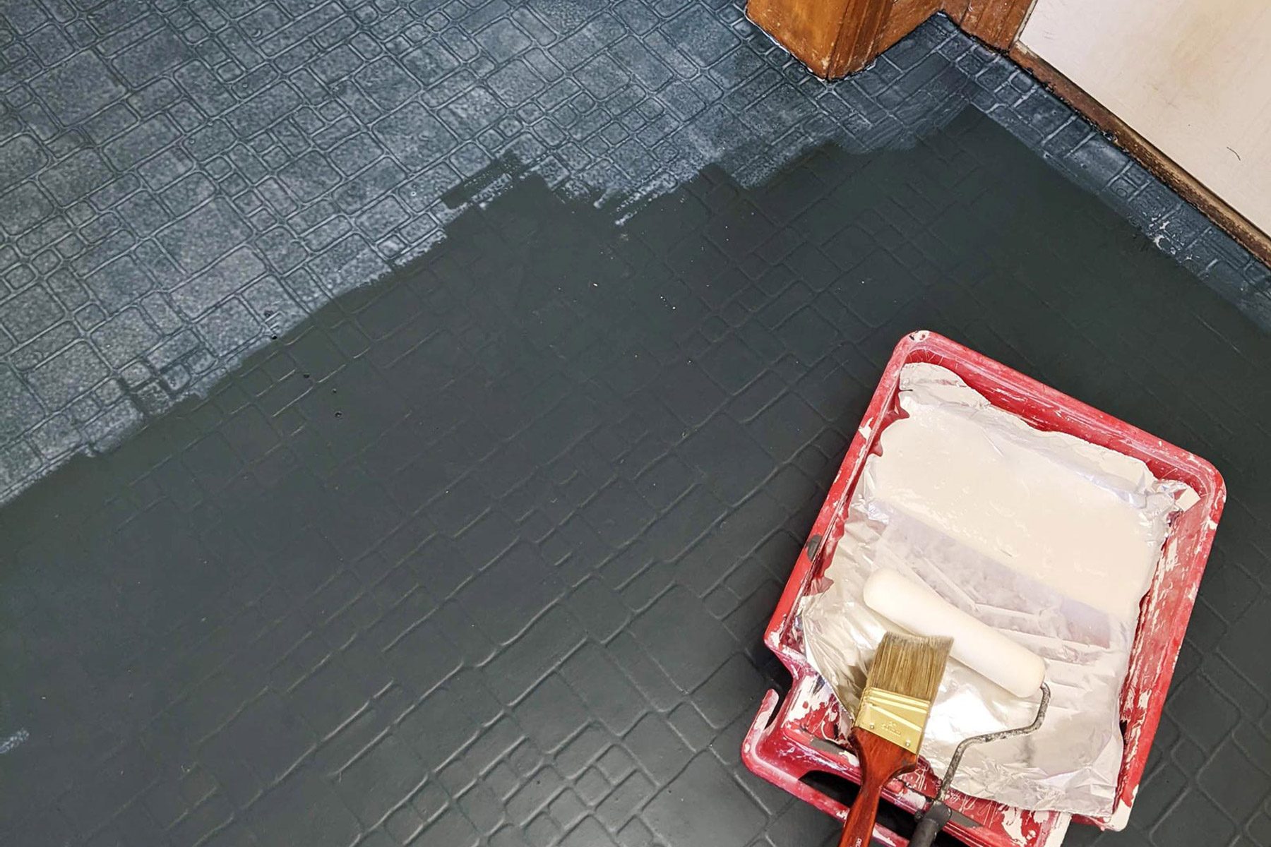 applying top coat of paint