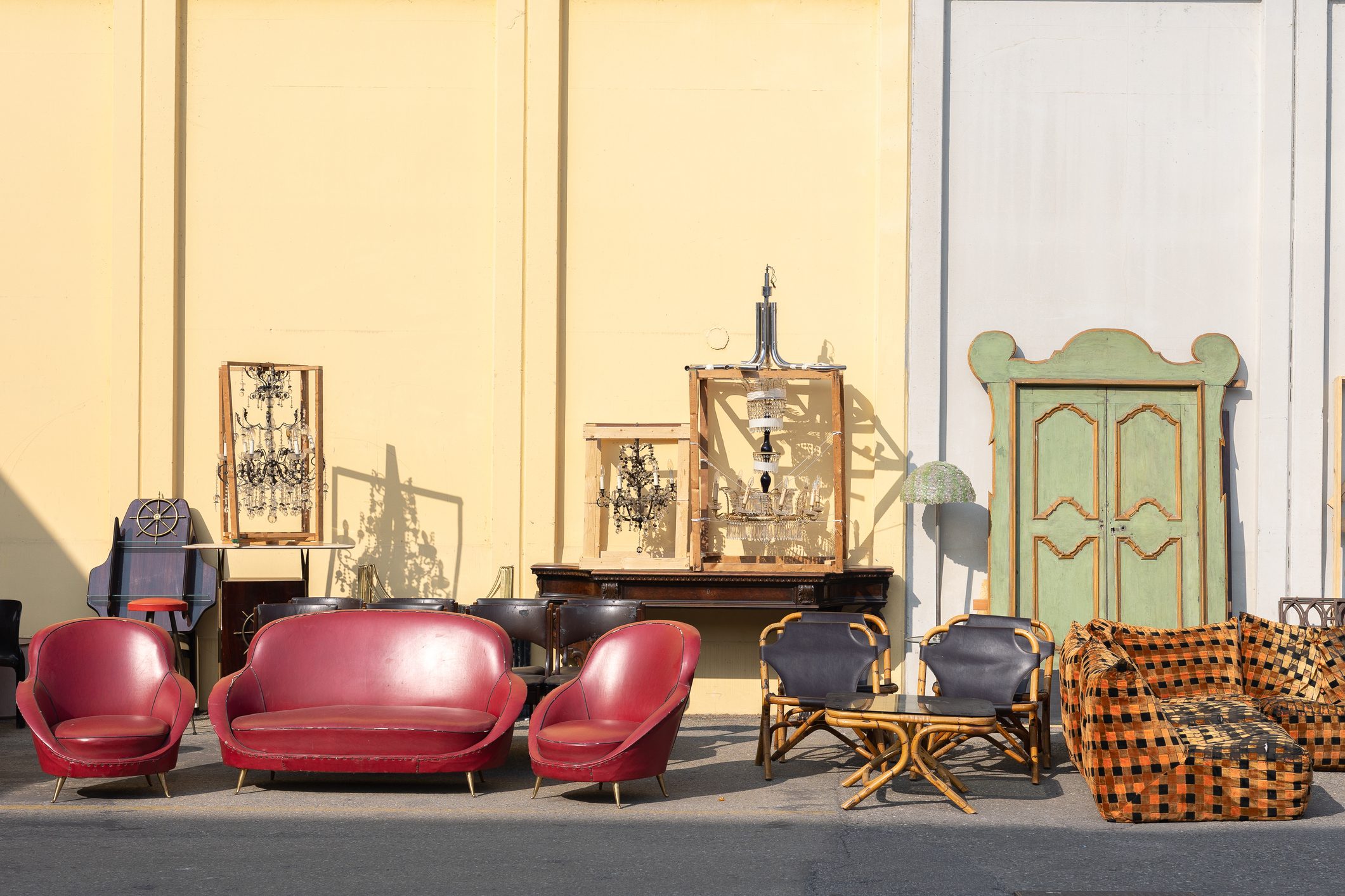 Antique Wooden Furniture, Cabinets, Sofas, Chairs and Mirrors Leaning Outside the garage