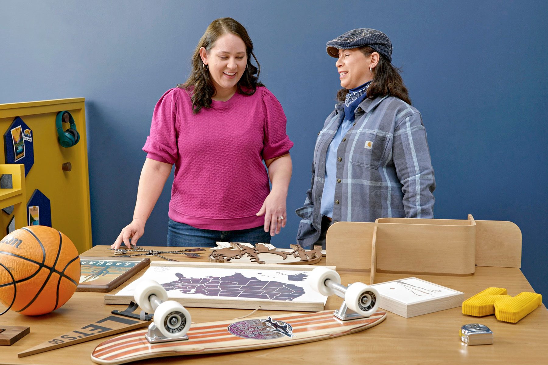 two women planning gallery wall layout