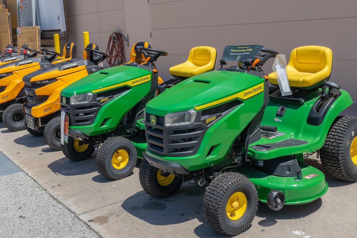 lawn mowers outside a home improvement store