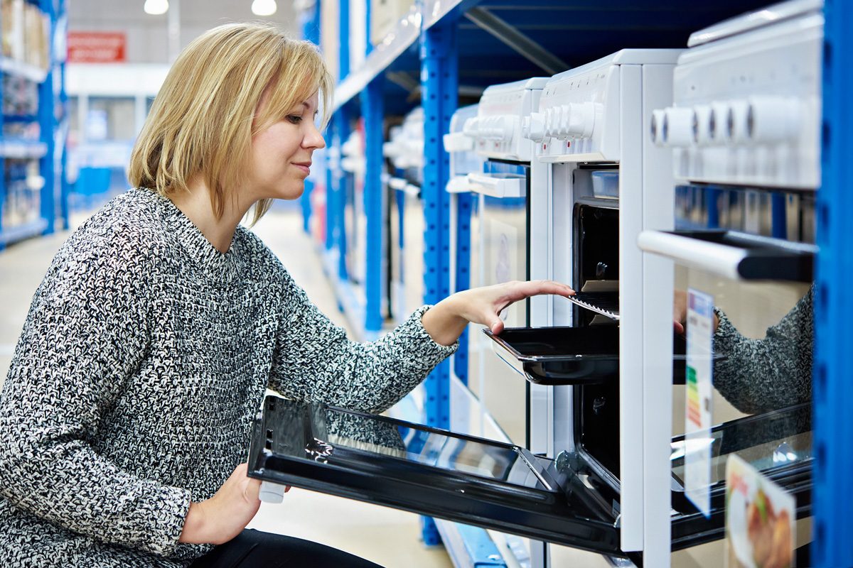 woman looking at appliances in a store