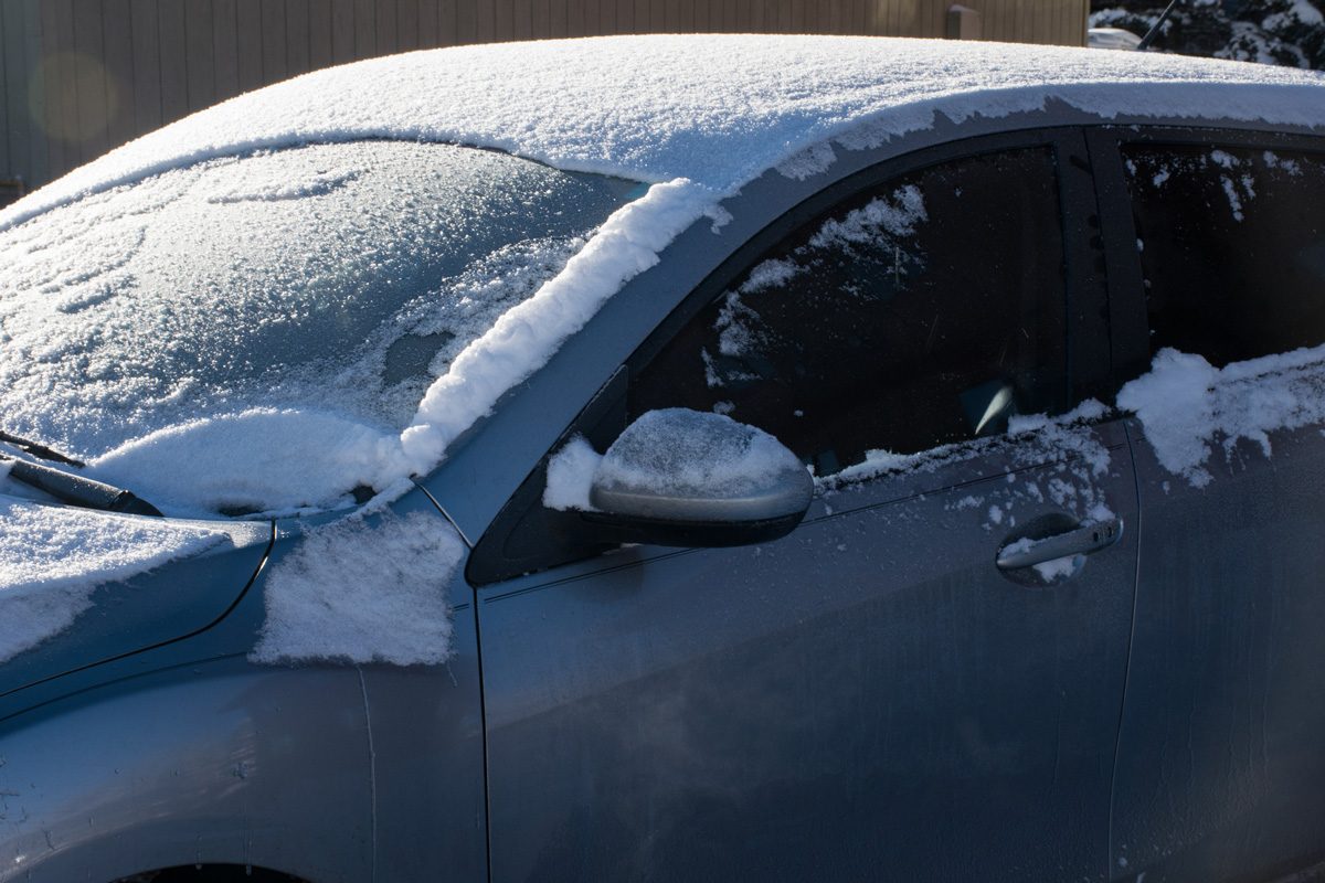 car covered in snow in winter