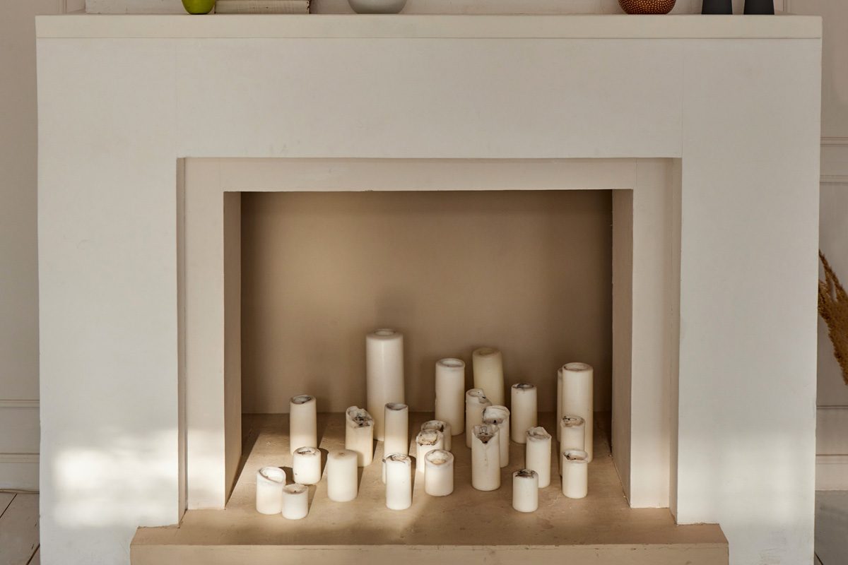 candles inside a fireplace