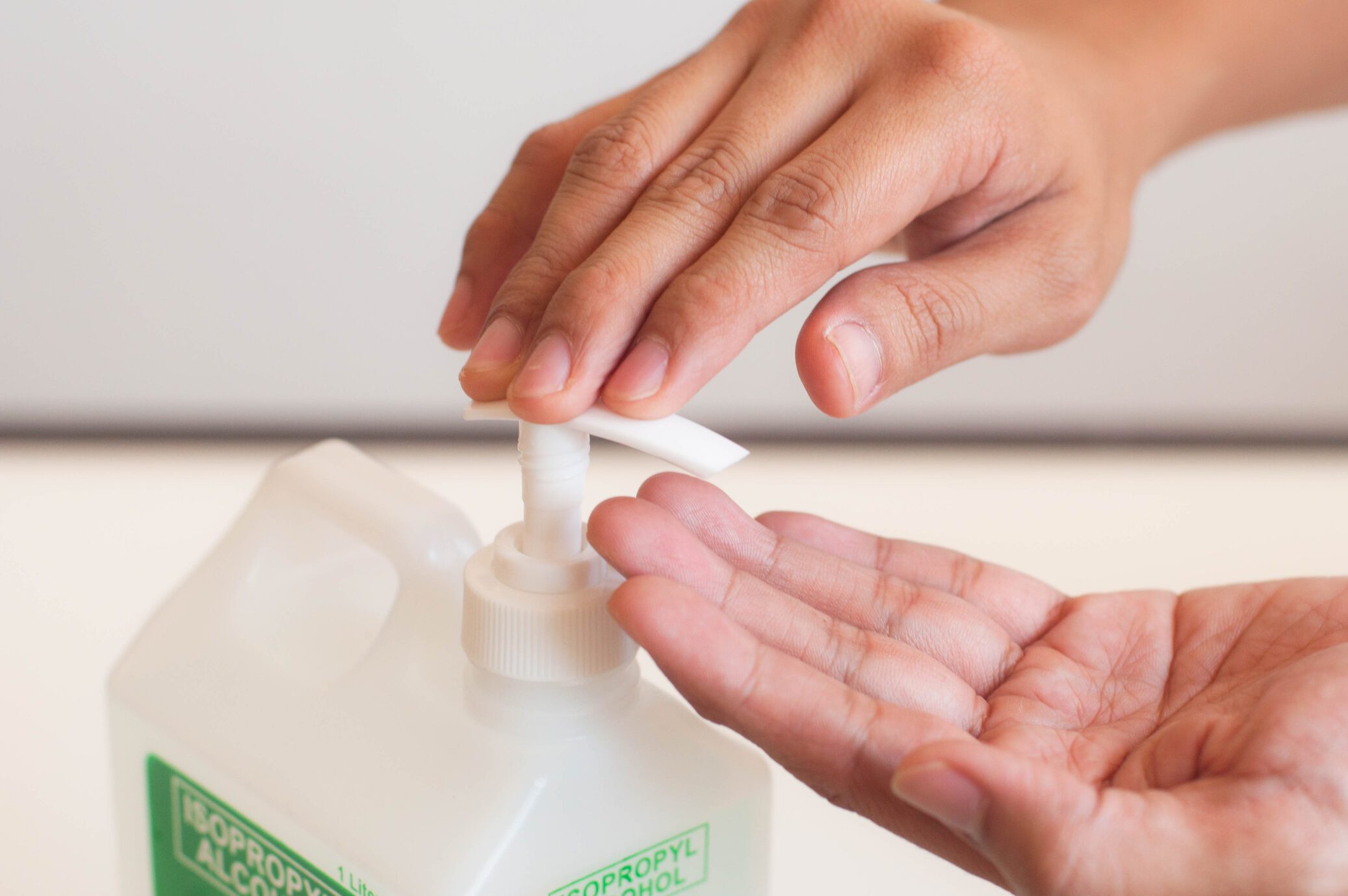 A young person is using rubbing alcohol