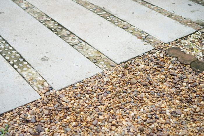 Rectangular concrete slabs placed on gravel