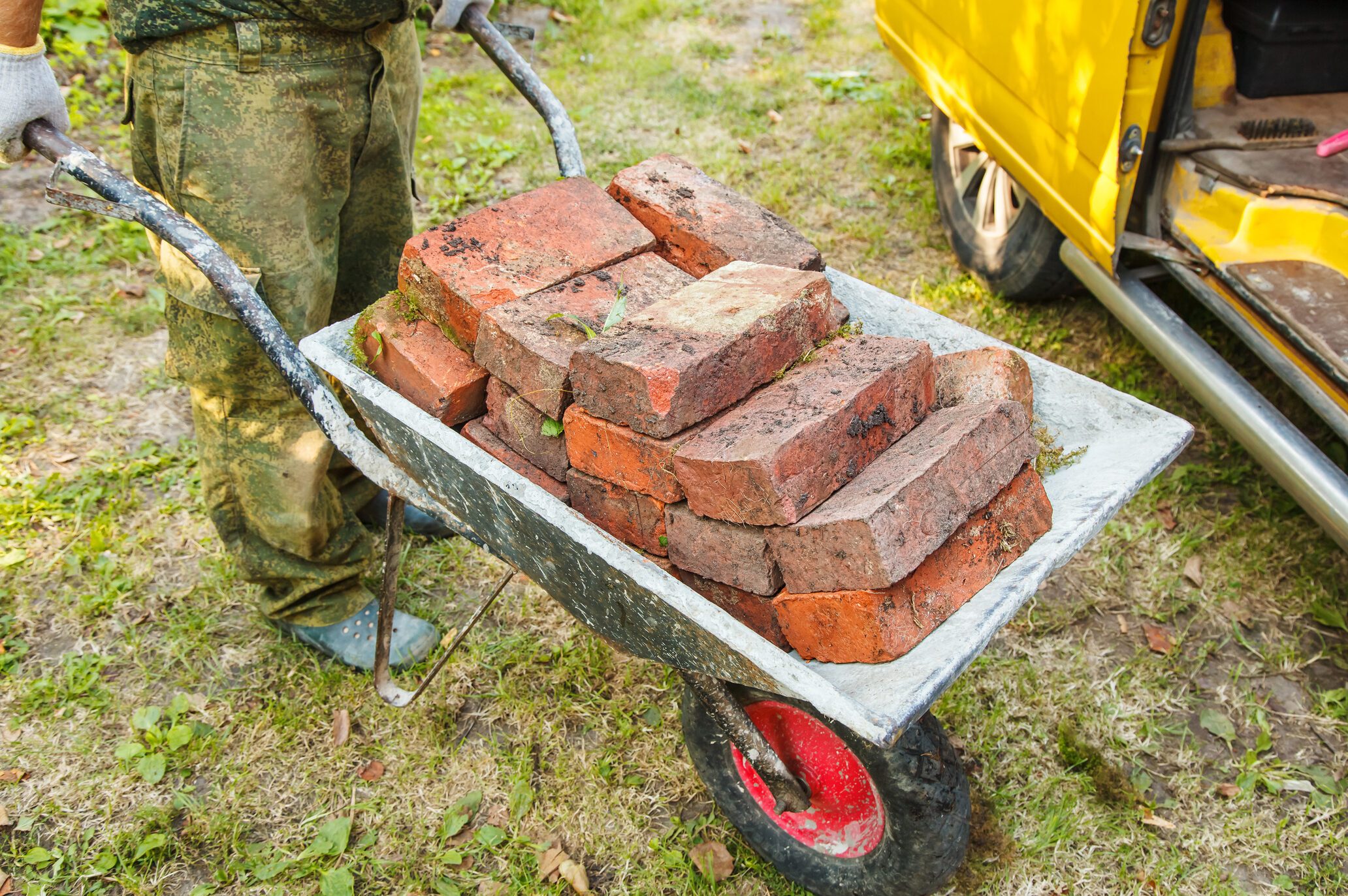 Pushing Bricks In Wheelbarrow