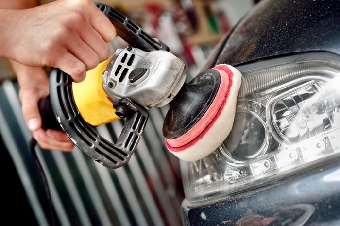 Car headlight cleaning with power buffer machine