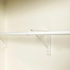 A Long white Rod For hanging Clothes on white wall