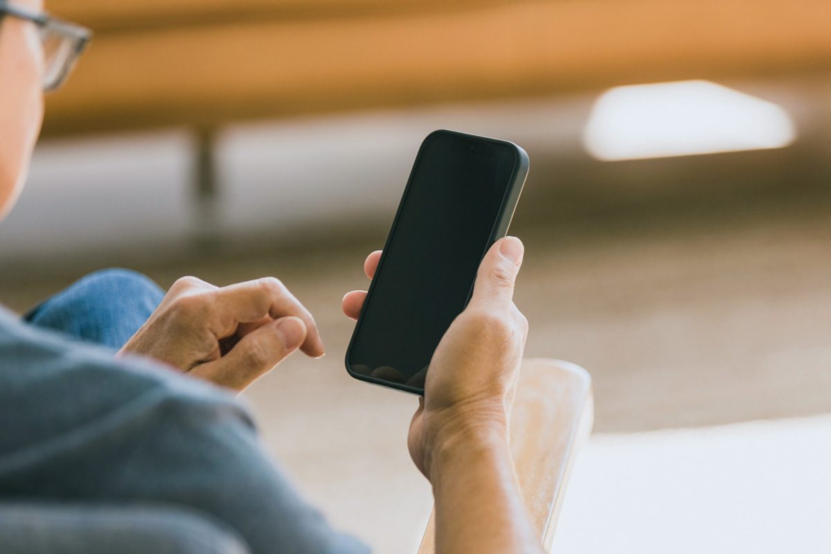 man turning phone off