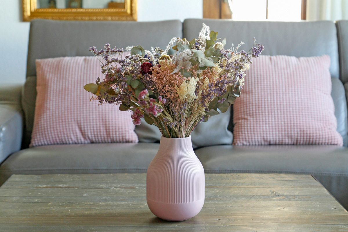 Close-up of dry flowers bouquet in jar at living room