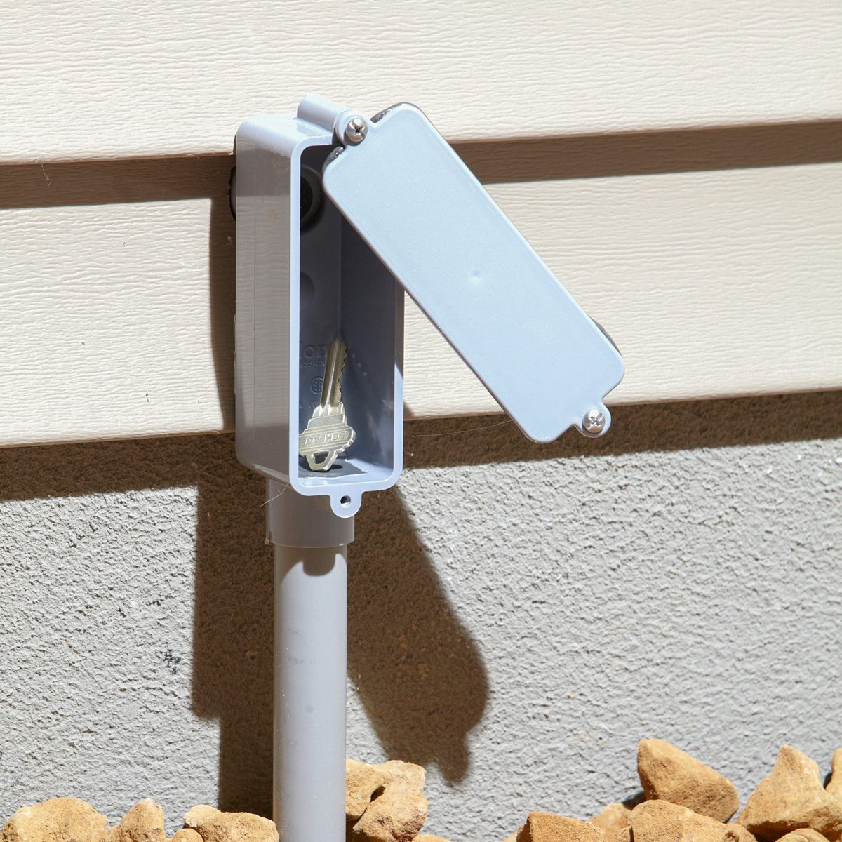 key hidden in phoney plastic LB fitting