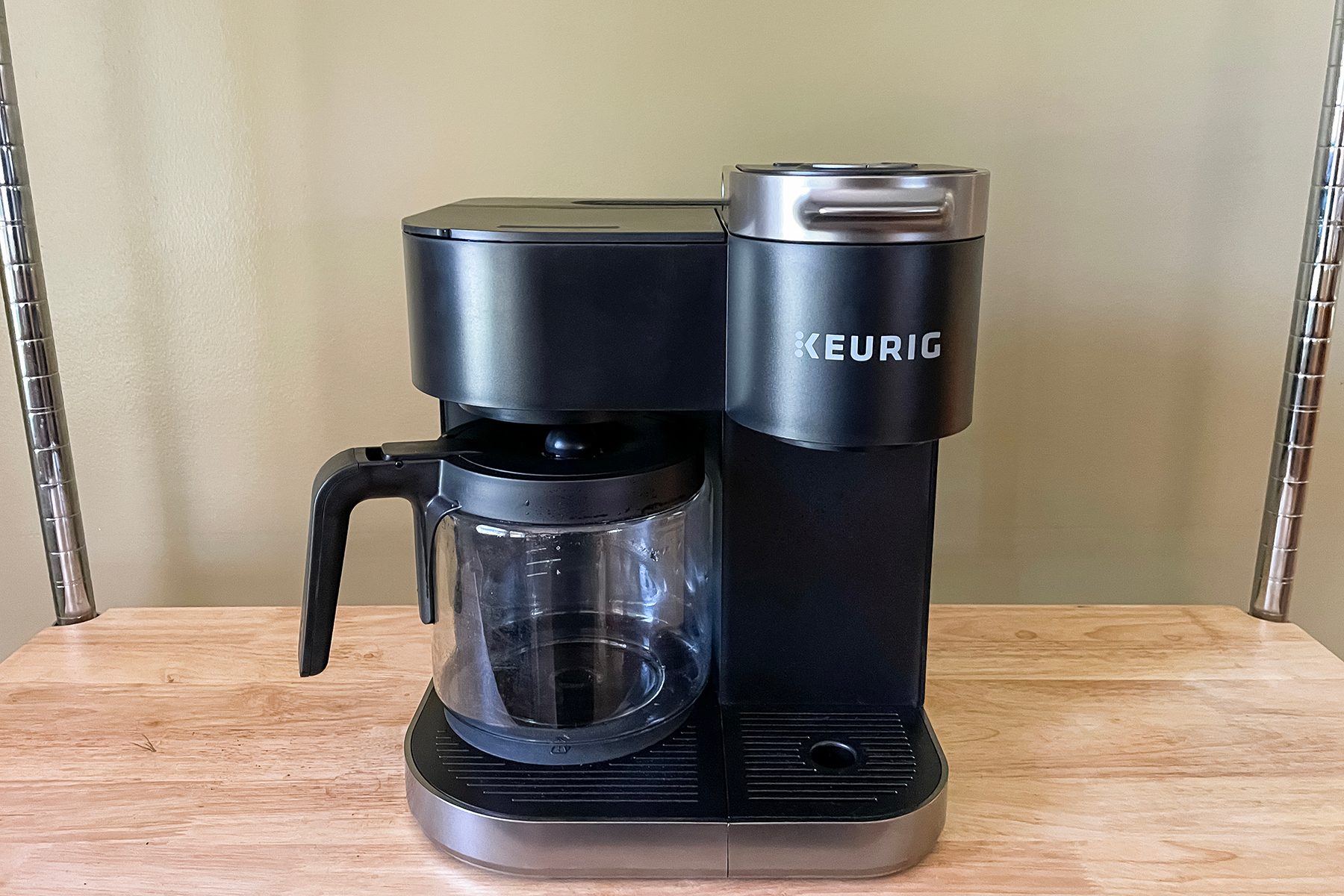 A Keurig K Duo Single Serve & Carafe Coffee Maker On A Table Top.