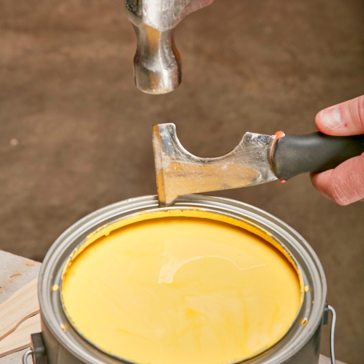 punching holes through the groove of the can