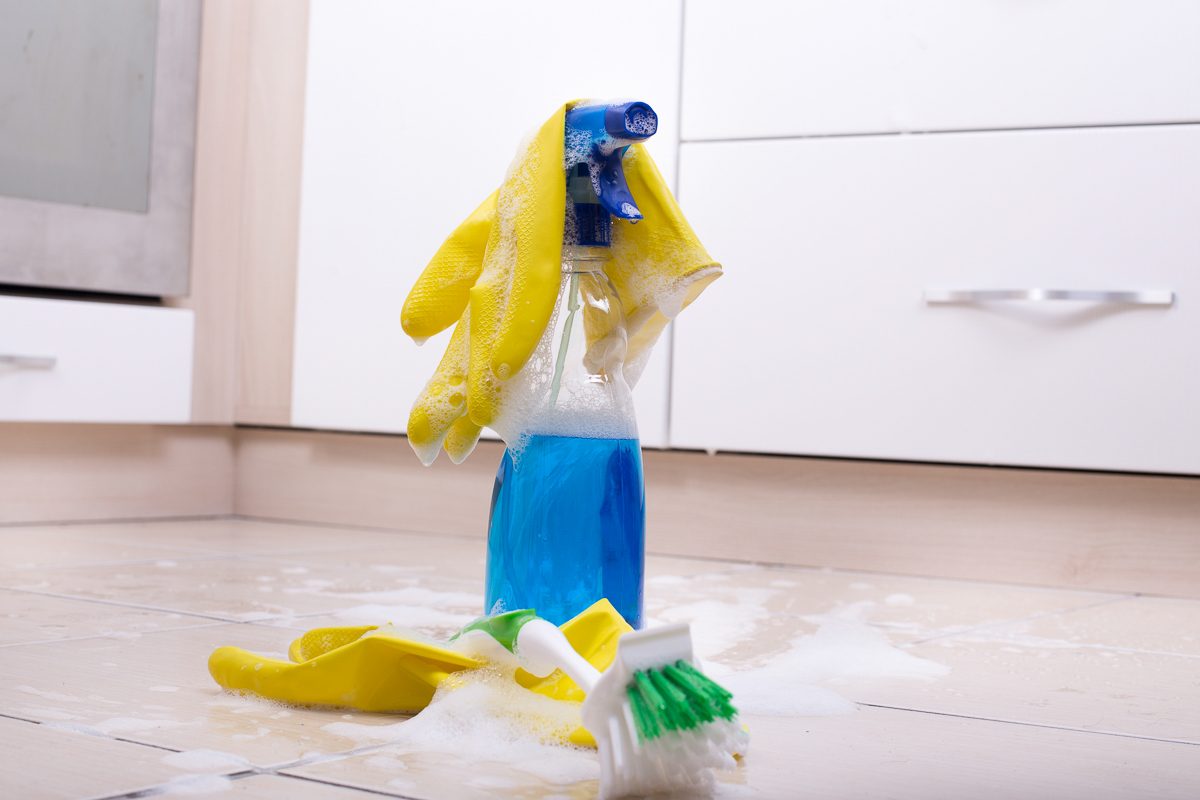 cleaning supplies on tiled floor