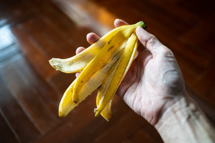 Banana peel in men hand