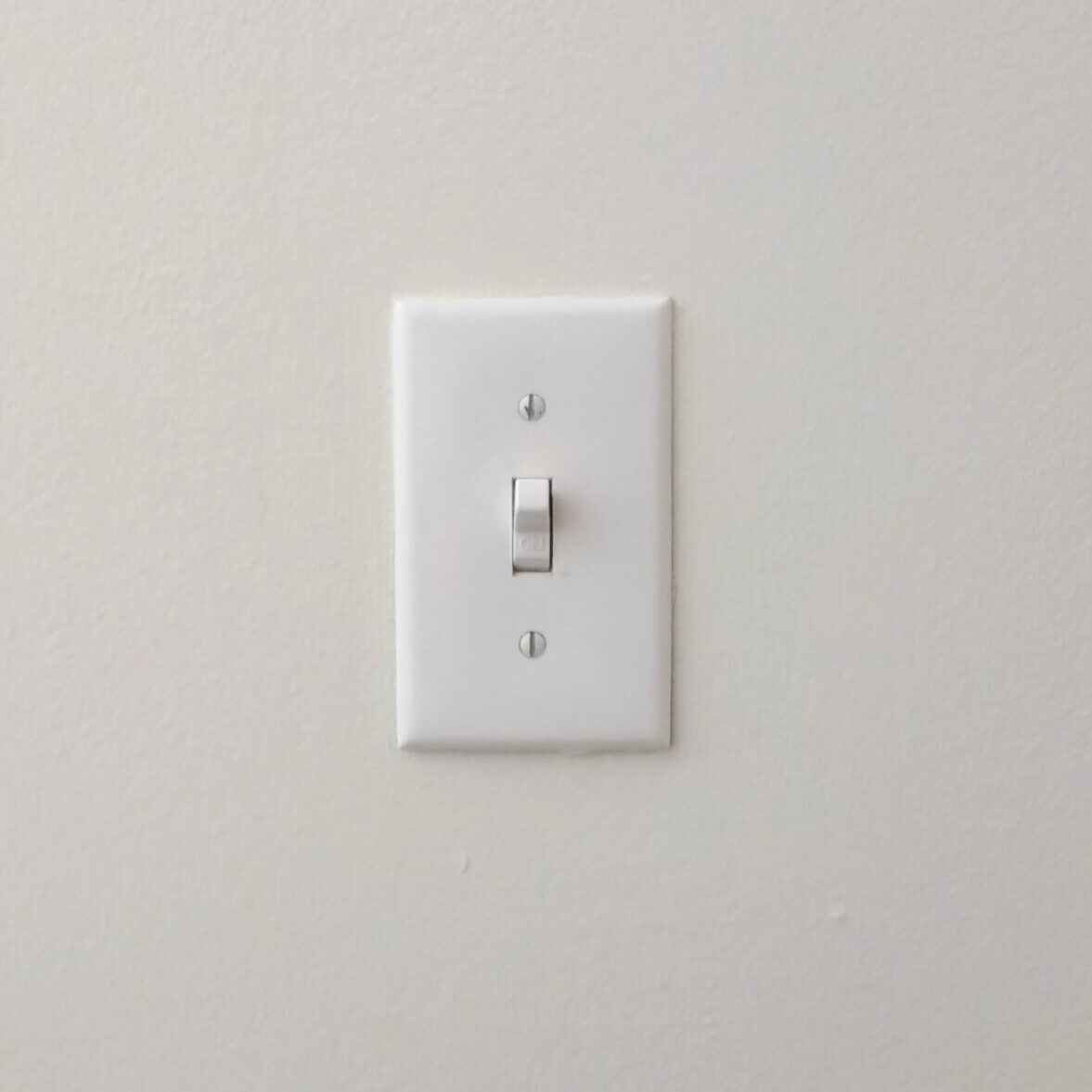 Close-Up Of Electric Switch On Wall