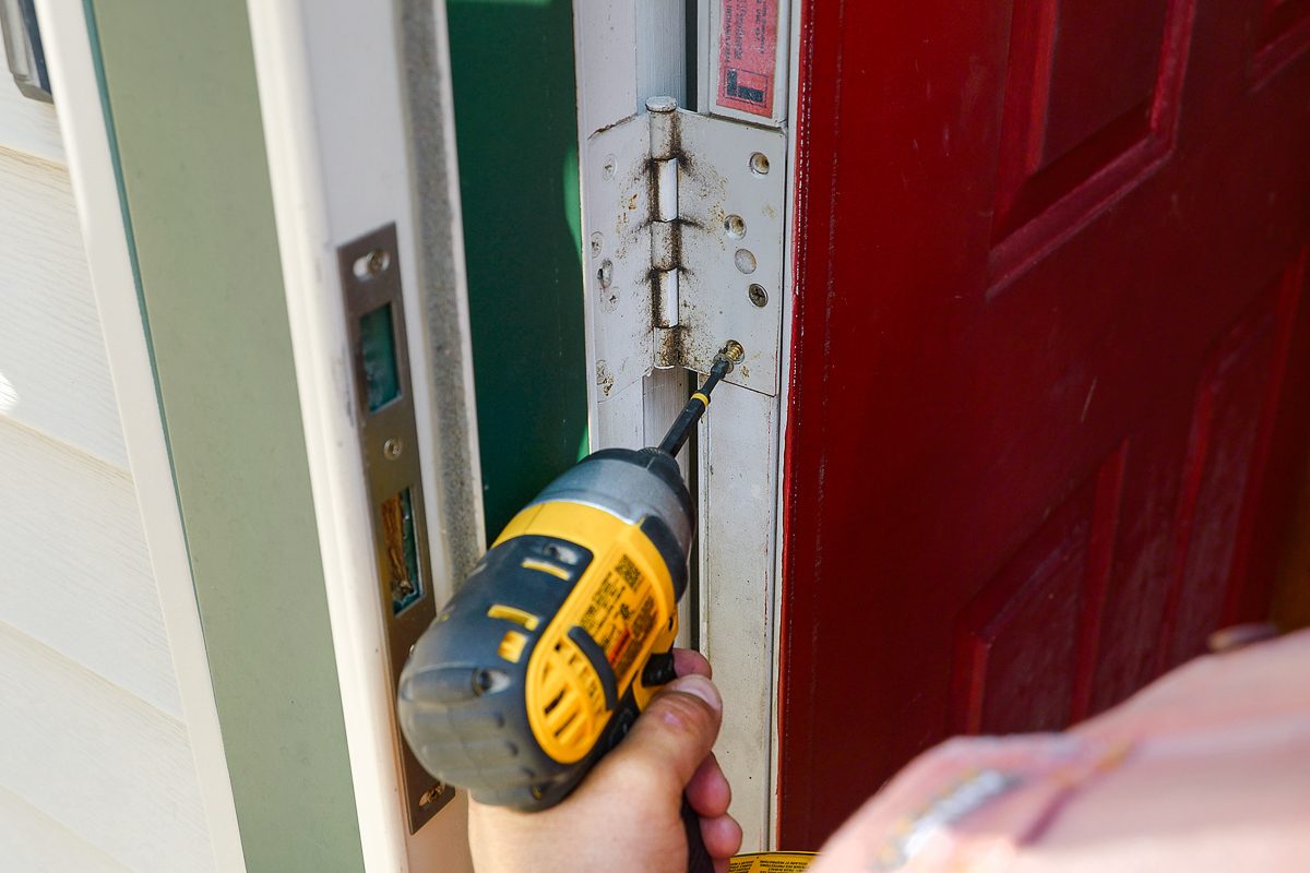 using drill to remove the door