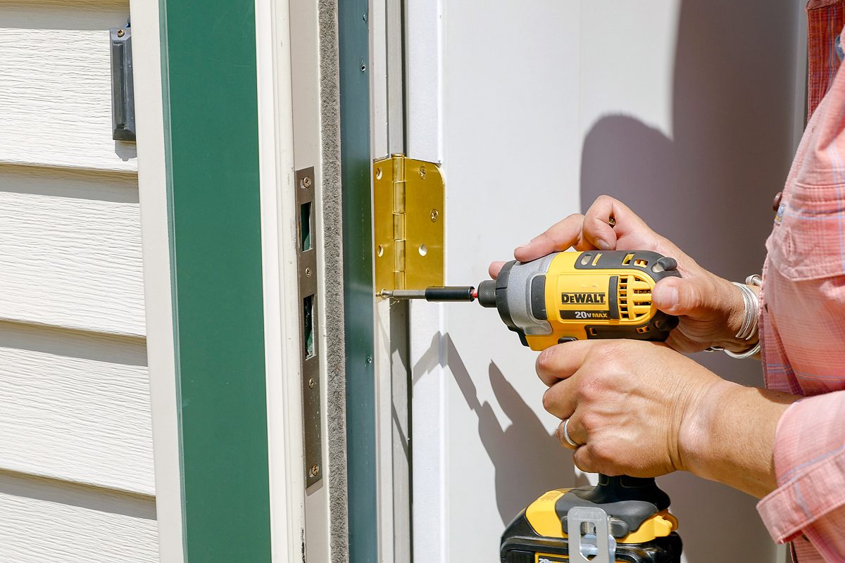 using drill to install new exterior door