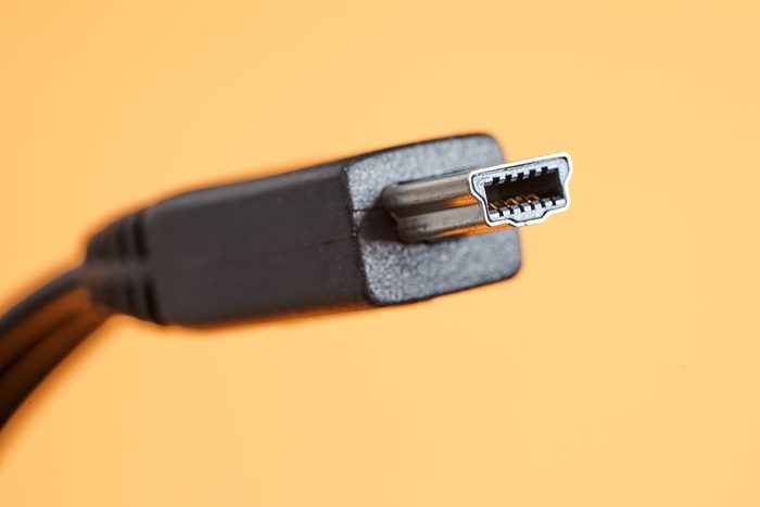 Front view of Mini USB connector on yellow background