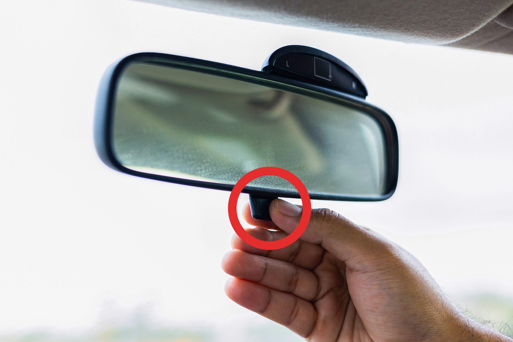 Do You Know What That Little Tab on Your Rearview Mirror Is For?