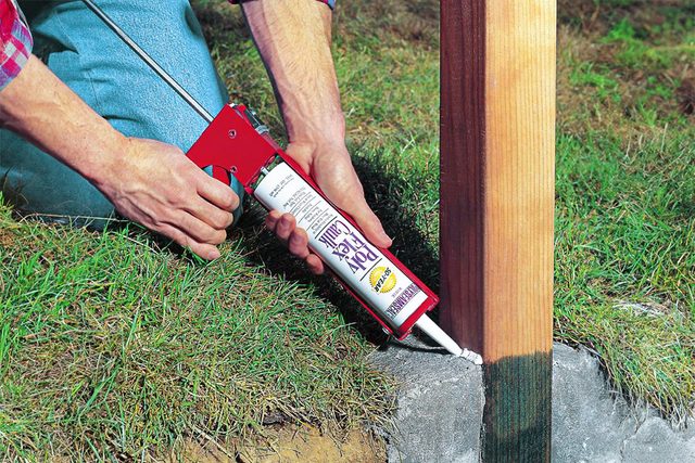 The final key to fence post installation is to seal the base with caulk
