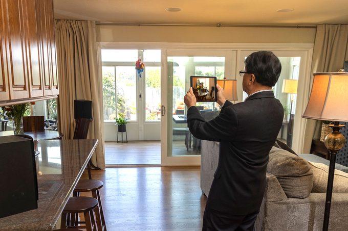 Real Estate Agent taking photos and doing a home inspection