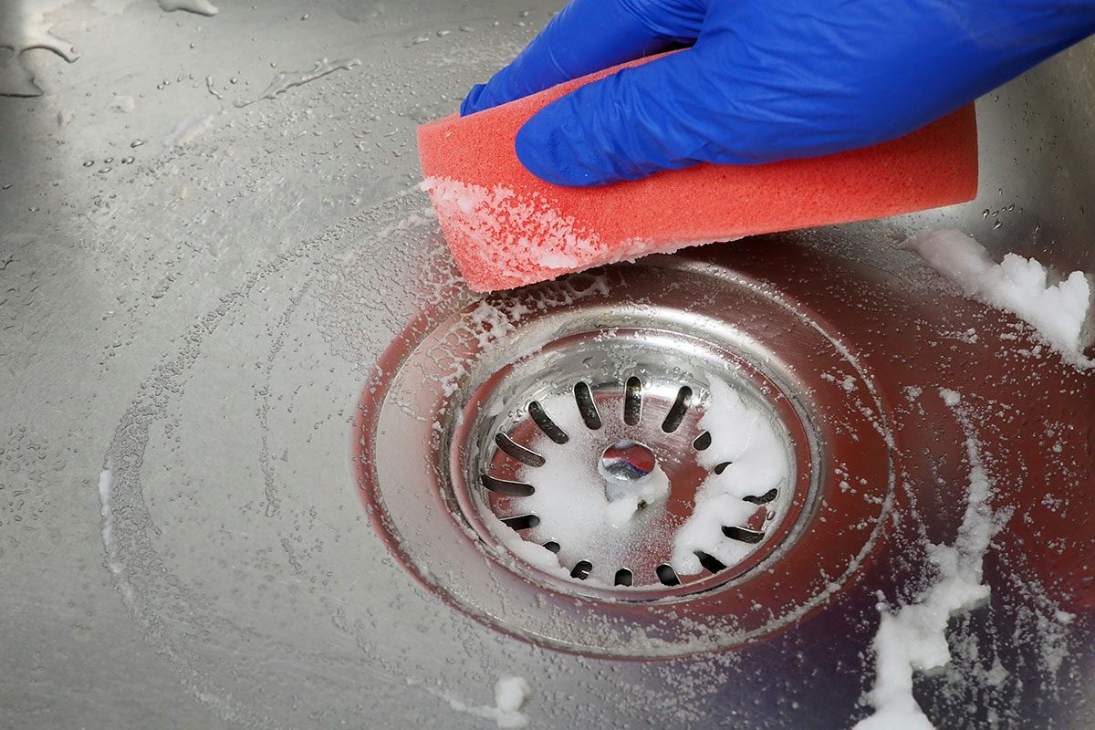 Vinegar and baking soda for cleaning the kitchen sink.