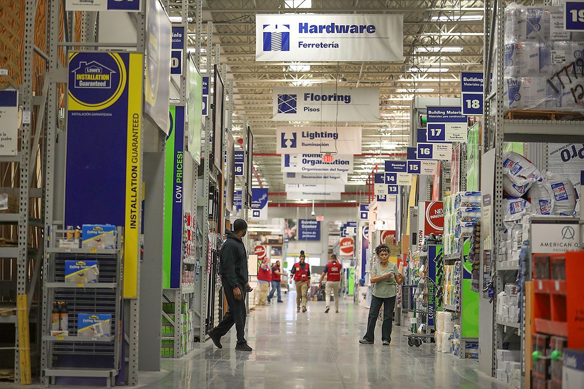 People shop at a Lowe's store